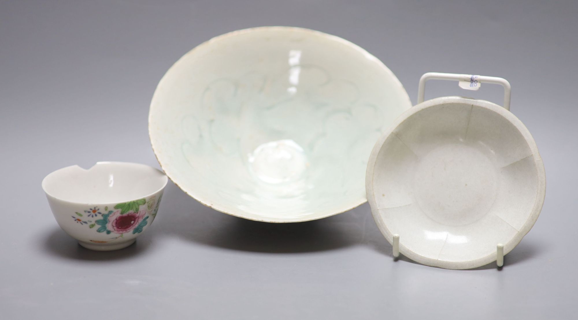 An 18th century Chinese famille rose tea bowl, together with a Qingbai type bowl and dish, largest diameter 17cm